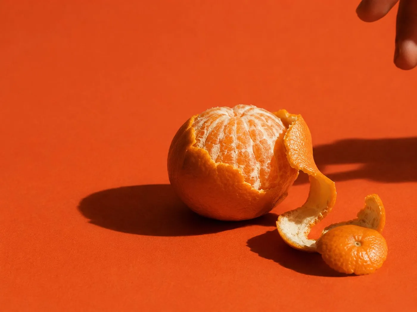 Peeled mandarin on terracotta — Keyra brand still life